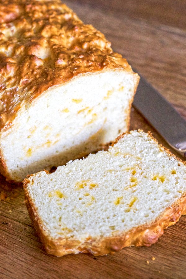 Easy Savory Cheese Bread - slice of bread on a wooden board