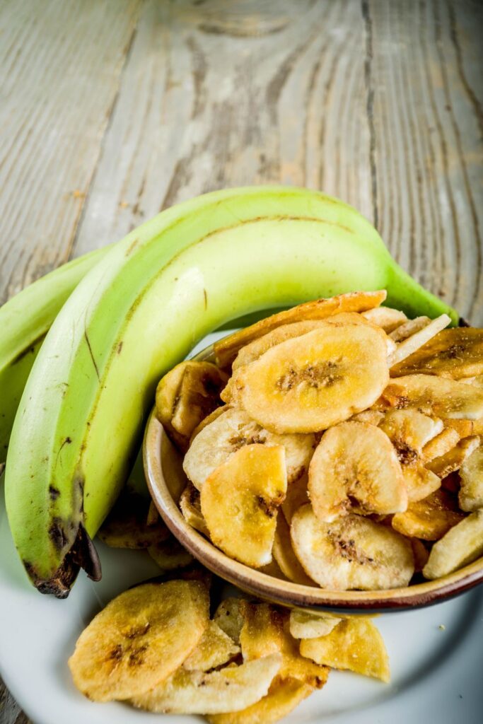 These spiced plantain chips recipe is an easy recipe for a great snack to have around the house. Lovely sweet taste, balanced by the chili peppers heat. Fried plantains in a bowl
