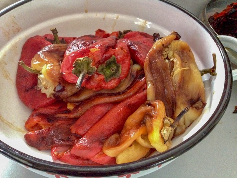 Grilled eggplant and bell pepper salad is a wonderful recipe to make all year long when you have eggplants and peppers available. Perfect as appetizer, or a snack served on slices of good crusty bread, this salad makes a handsome option for entertaining. roasted peppers in a bowl