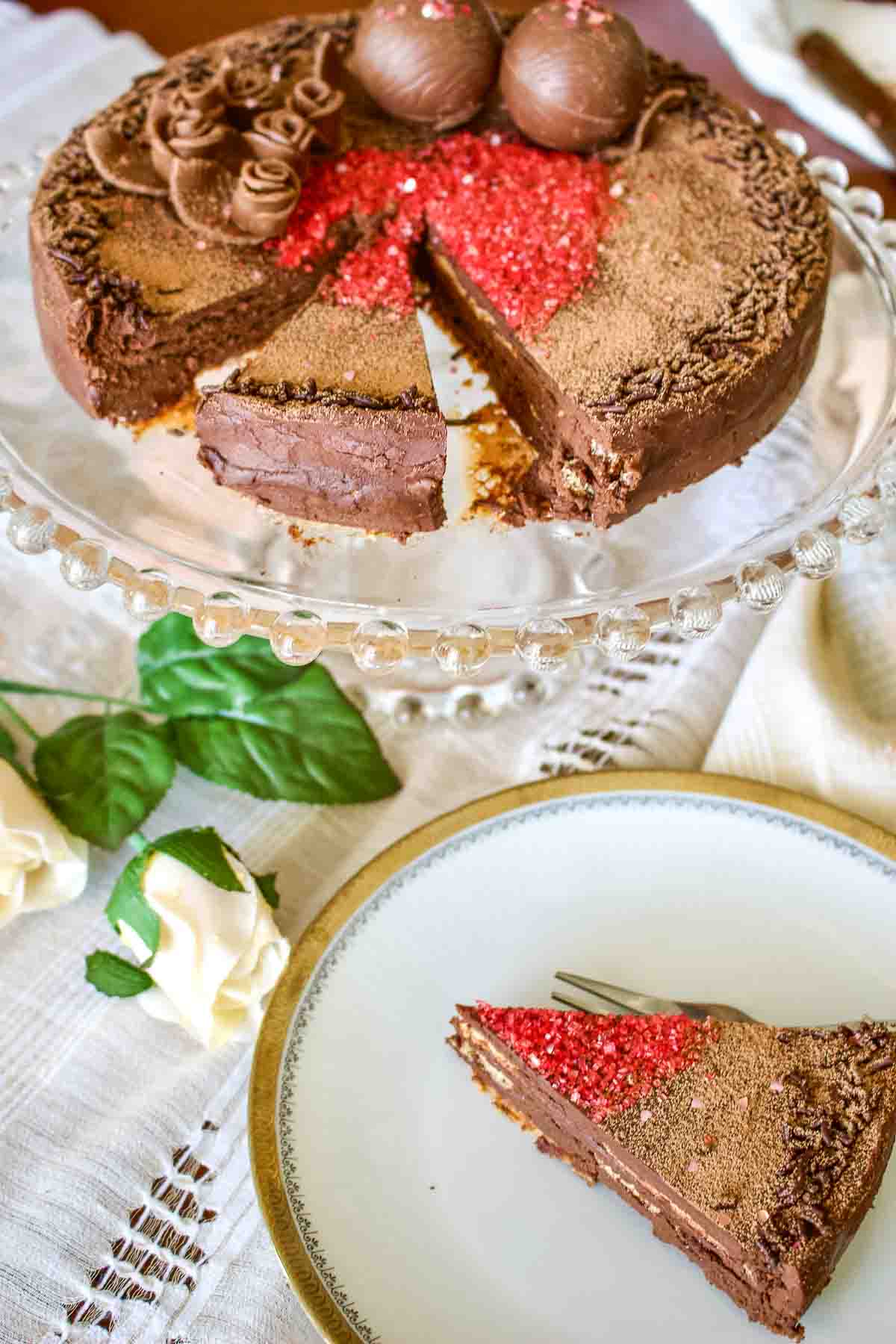 This is a classic European chocolate ganache meringue torte recipe. Easy to make but decadent, this recipe is the perfect option for the chocolate lovers. Meringue Chocolate Cake on a plate.