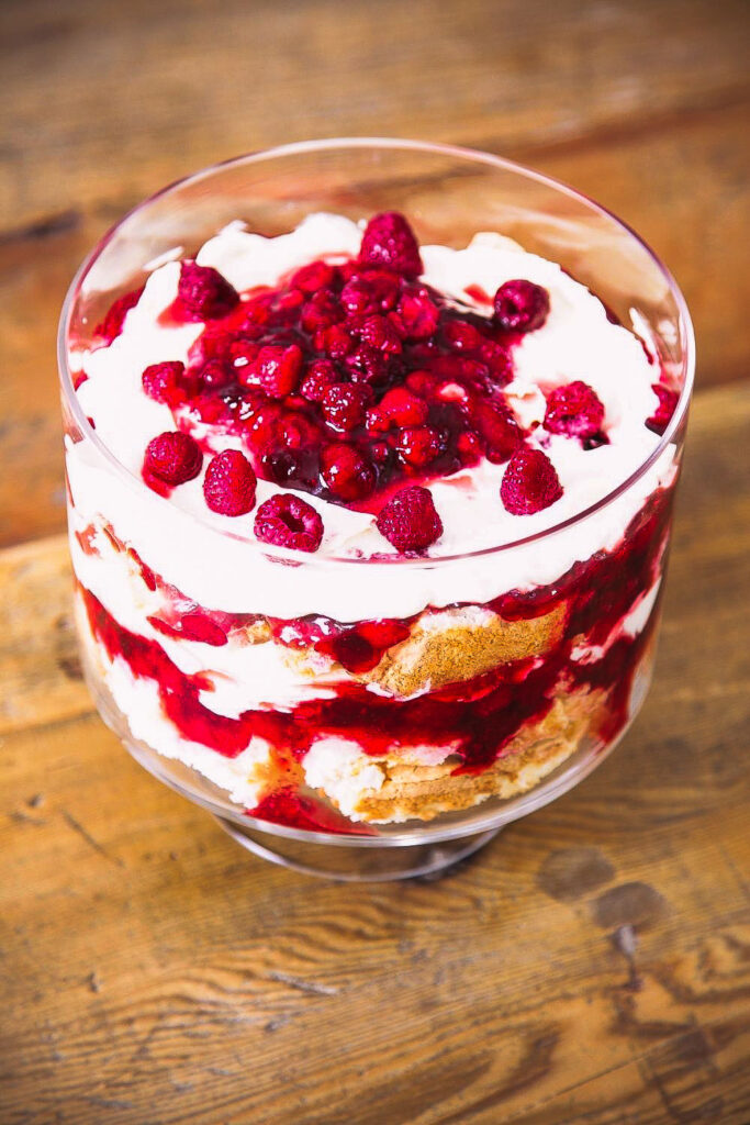 This five minutes trifles dessert can be made all year round. A wonderfully indulgent combination, sweet, creamy and with the added textures of fruit, sponge or lady fingers, it is an ideal finish to a meal. Triffle Dessert in a glass bowl