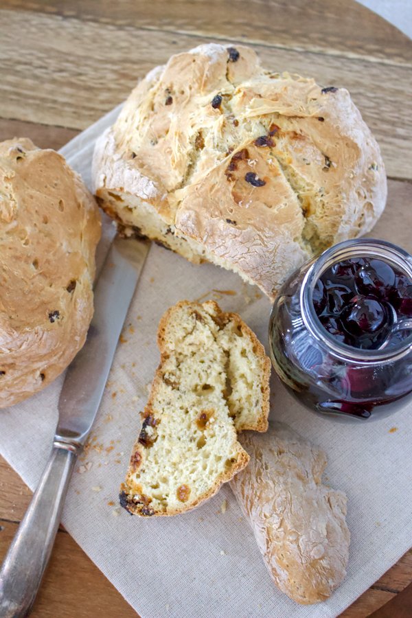 American Irish soda bread American Irish soda bread- sliced bread with knife and cherry preserves in a jar, overhead picture