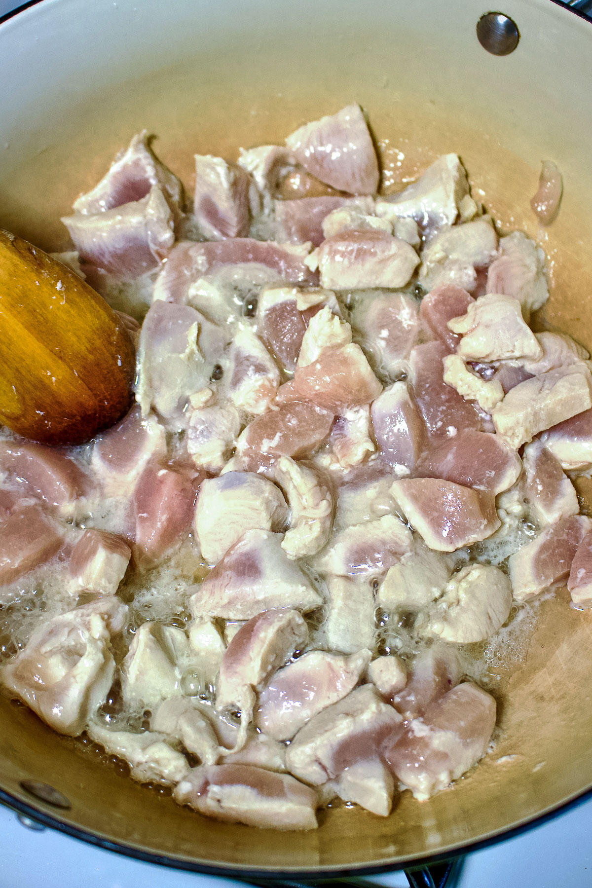 Chicken breast cooking in the pan