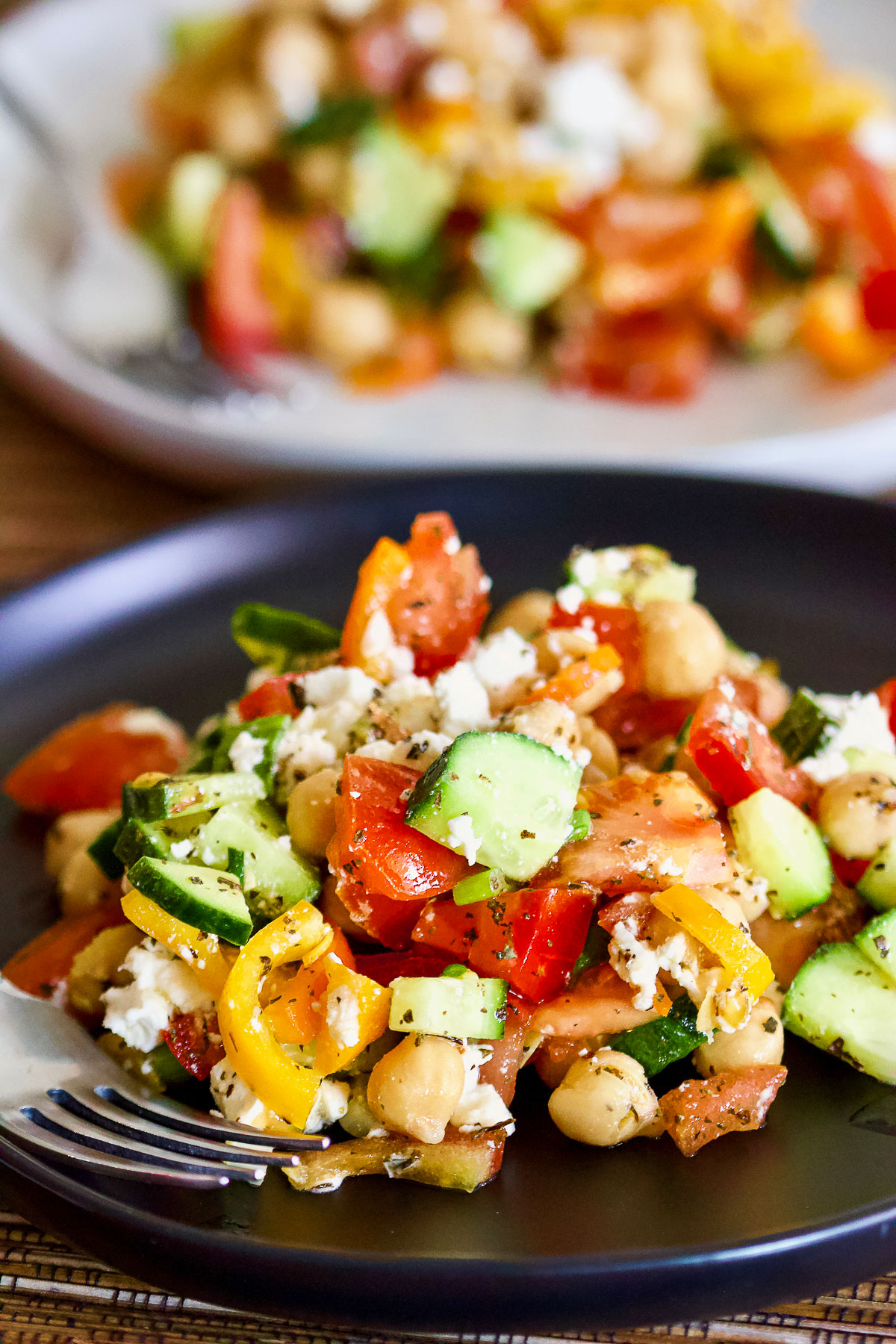 Easy Chopped Chickpea Salad With Feta And Mint8 Chickpea Salad on a black plate.