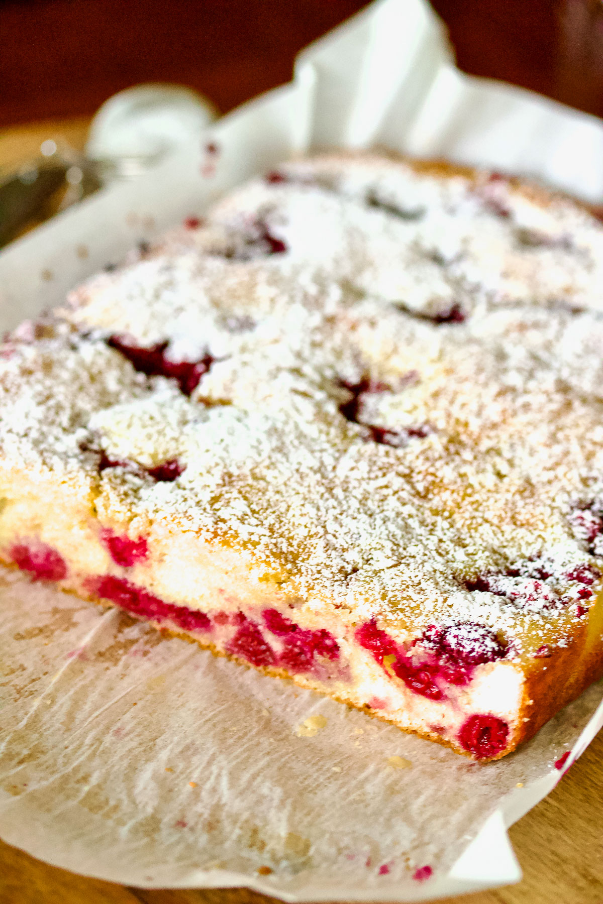 Buckle cake with berries on a wooden board