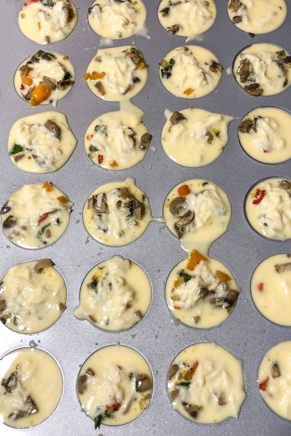 Unbaked Mini vegetarian quiche0