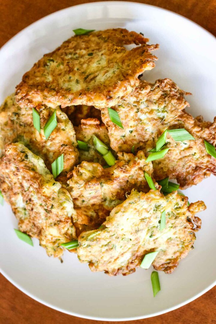 Zucchini Feta Fritters on a white plate.