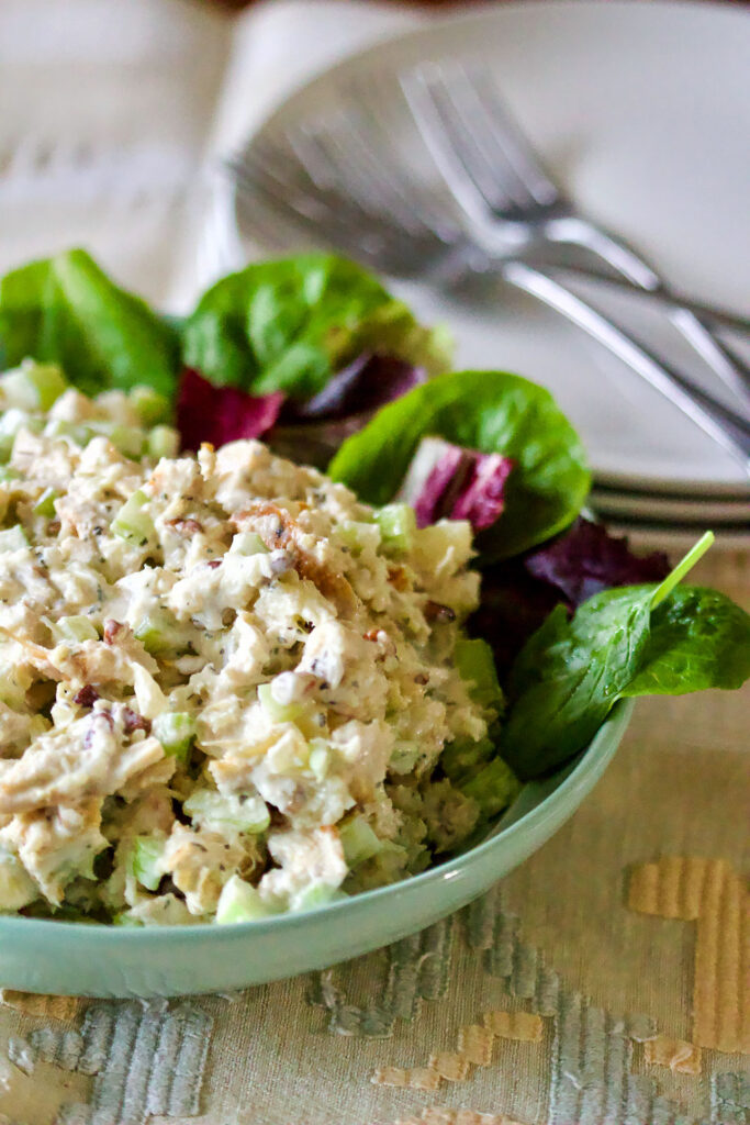 Classic Pineapple Chicken Salad is easy to make, healthier and delicious. The dressing is made with creamy Greek yogurt instead of mayonnaise. Pineapple Chicken Salad with white plate in the background0