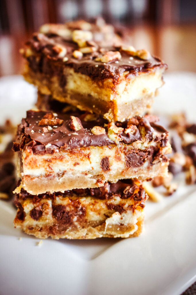 Stacked Austrian Chocolate Cream Cheese Bars on white plate0