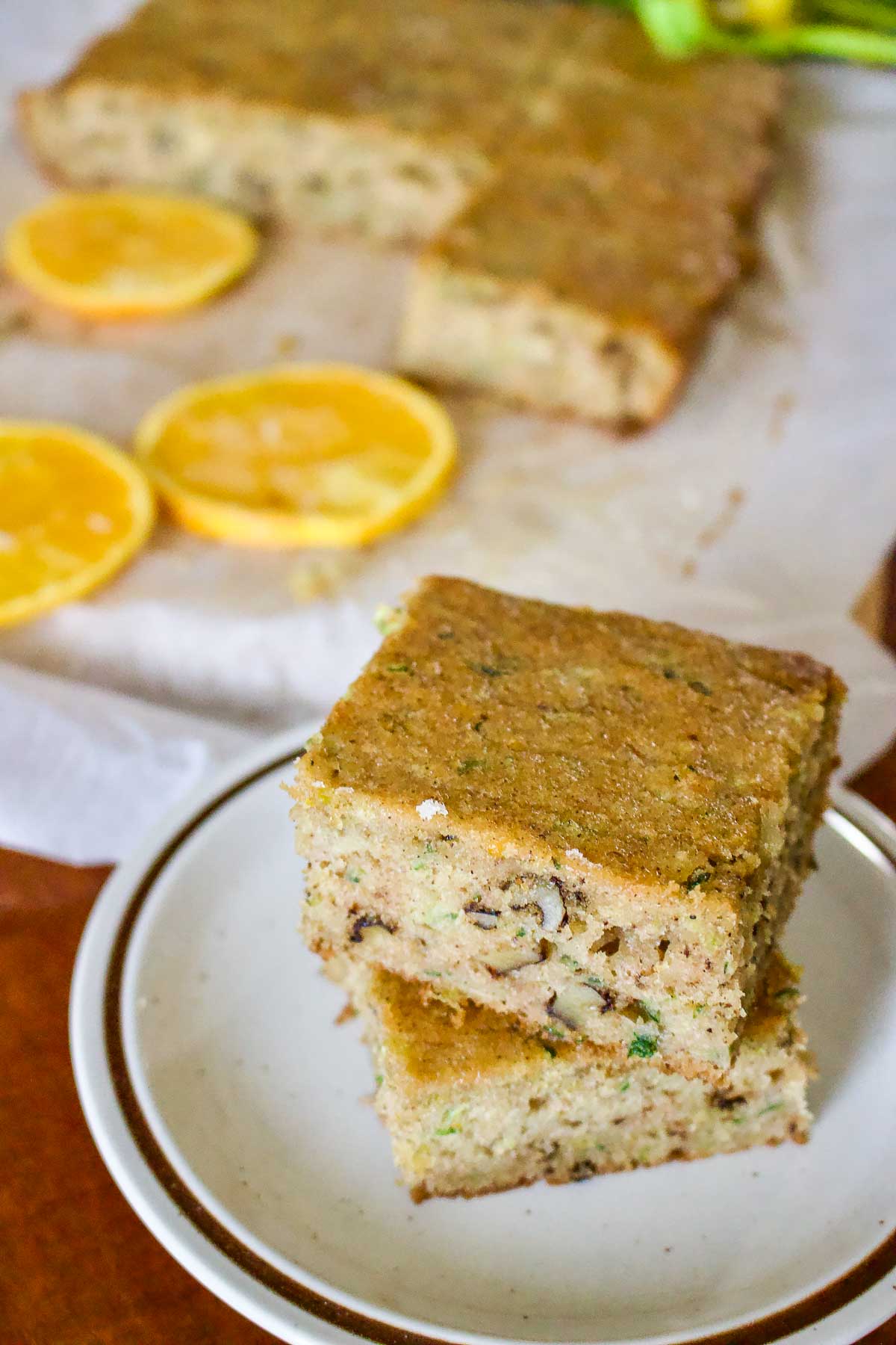 Zucchini Orange and Walnuts Cake33 Zucchini Walnut Orange Bread sliced on a platter.