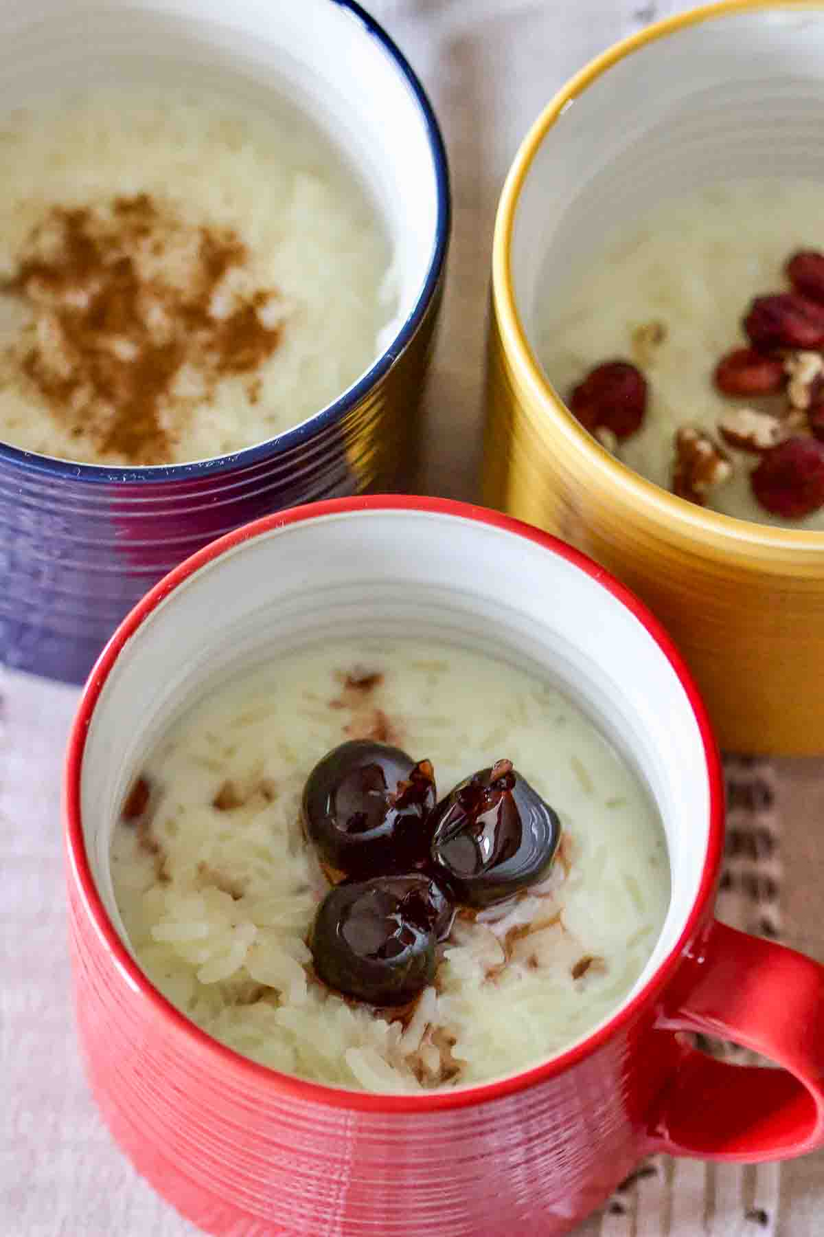 Classic Stove-Top Rice Pudding- Classic Rice Pudding in three colored cups.