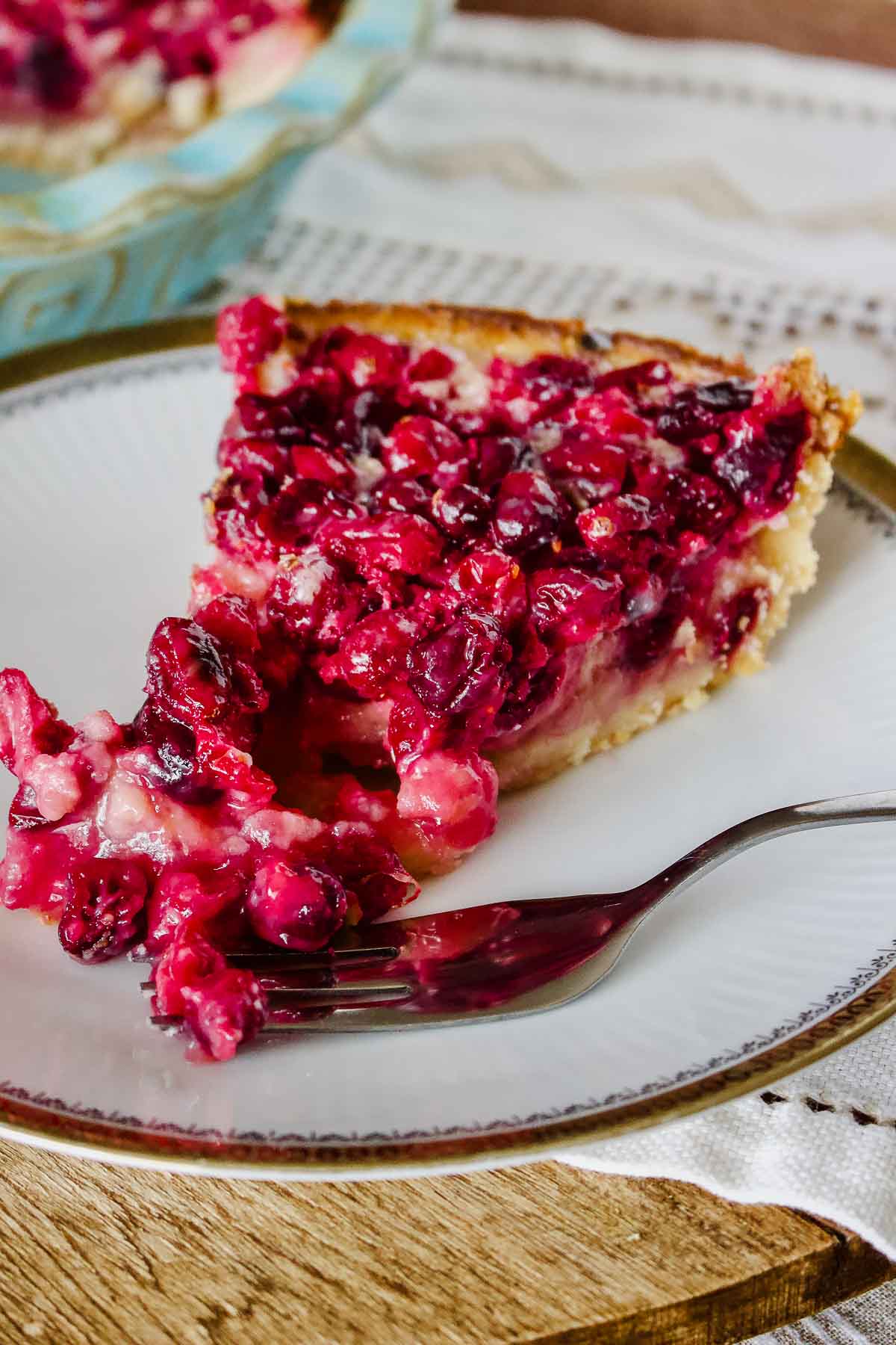 Cranberry Custard Pie slice on a white plate.