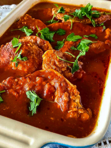 Pork in garlic tomato sauce in a baking pan square image1200