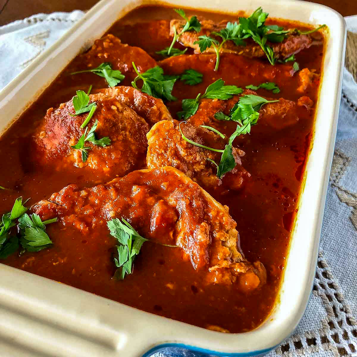 Pork in garlic tomato sauce in a baking pan square image1200