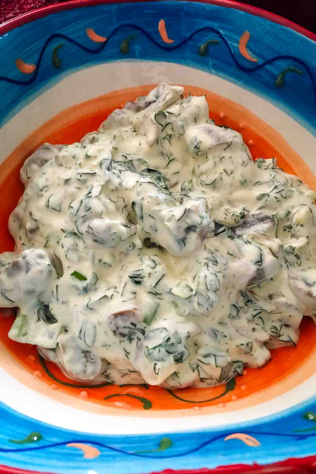 Romanian Creamy Garlic Dill Mushroom Spread in a colorful bowl.