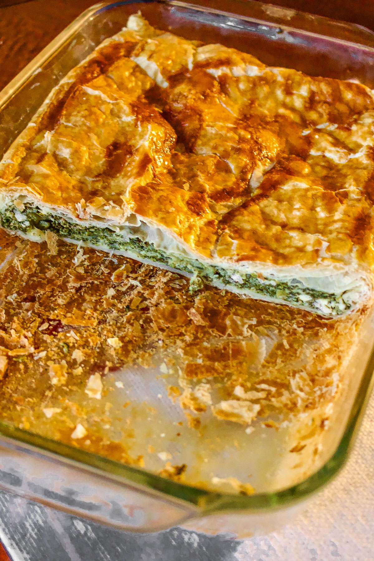 Spinach Feta Cheese Pie sliced in a glass pan0