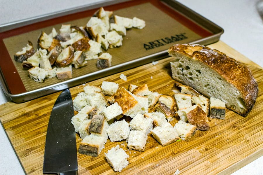 bread cubed ready to be toasted in the oven for strata