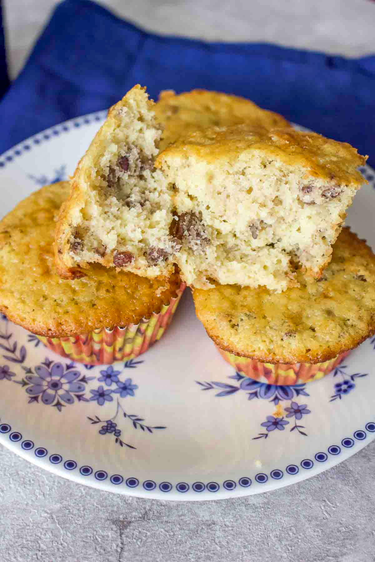 Here you have a no fail easy banana nut muffins recipe that is delicious and perfect for breakfast or as a snack. Banana Nut Muffins stacked on a plate.