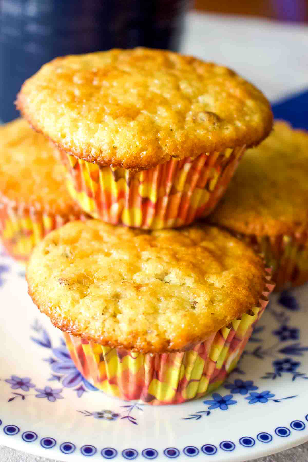 Here you have a no fail easy banana nut muffins recipe that is delicious and perfect for breakfast or as a snack. Four Banana Nut Muffins On Plate.