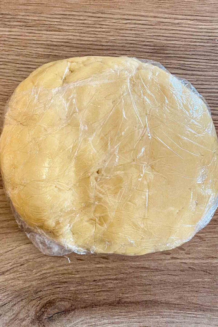 Dough in plastic wrap.