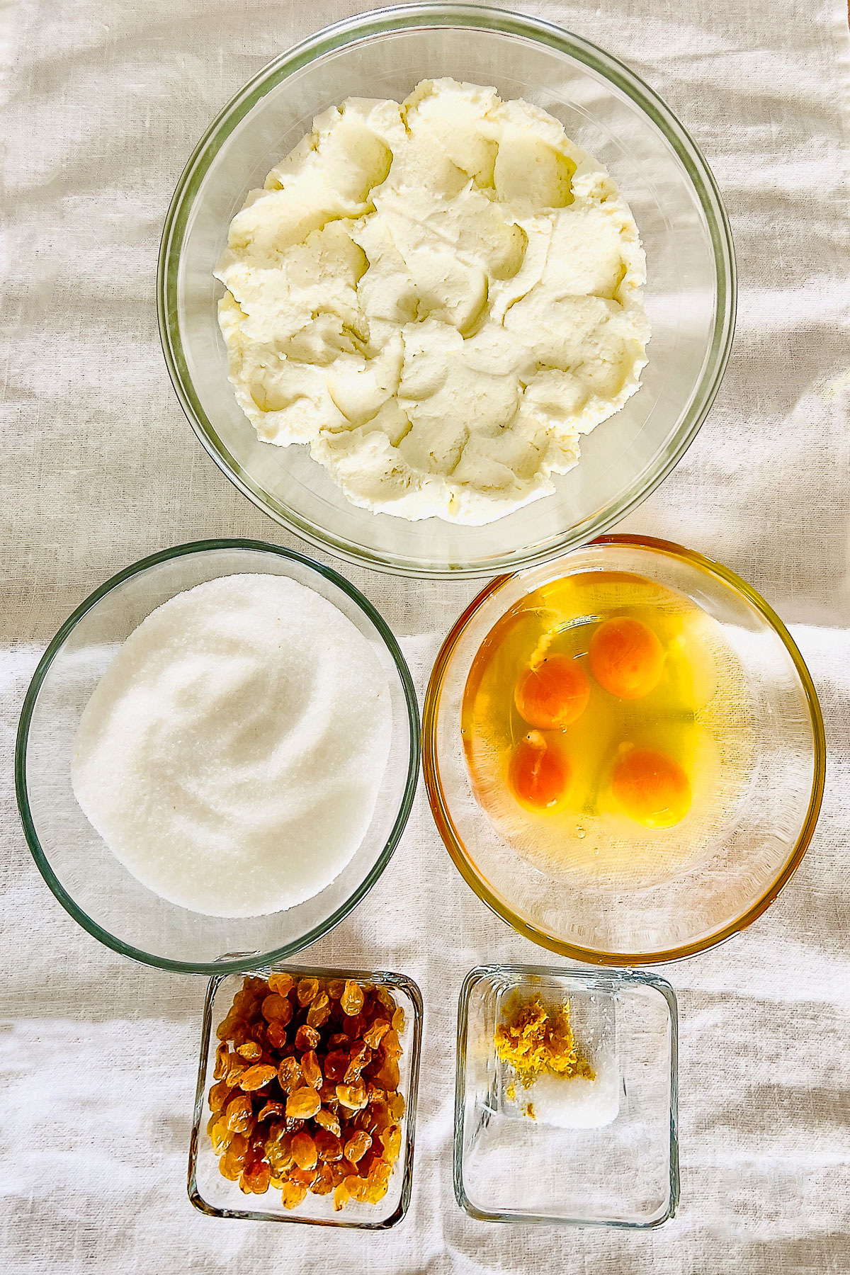 Ingredients for the cheese mixture on display on white towel