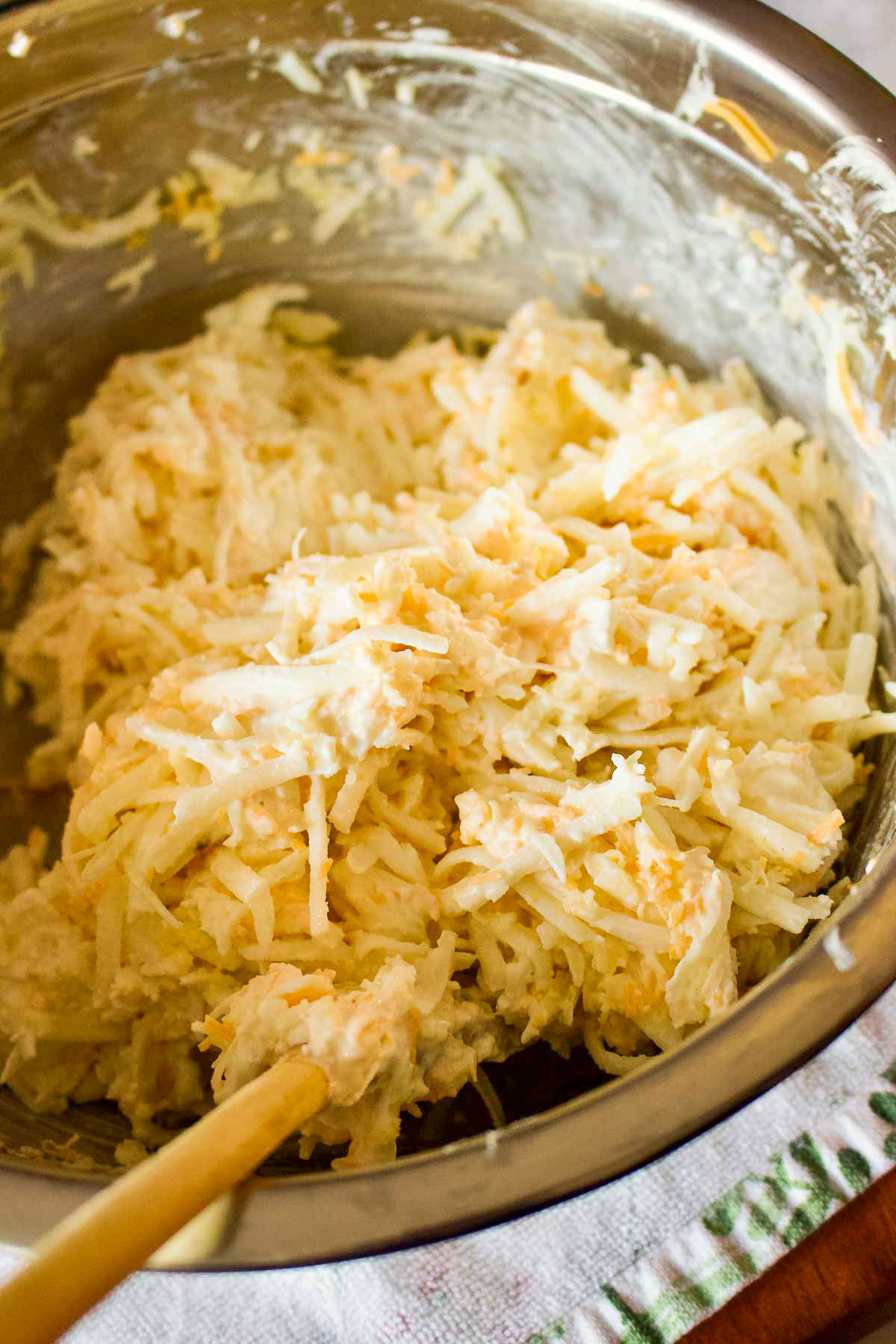 Mixed ingredients for Funeral Cheesy Potatoes.