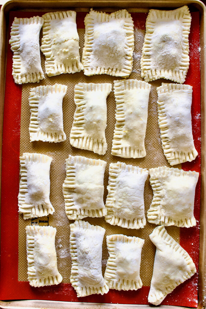 unbaked pastries on the baking tray0