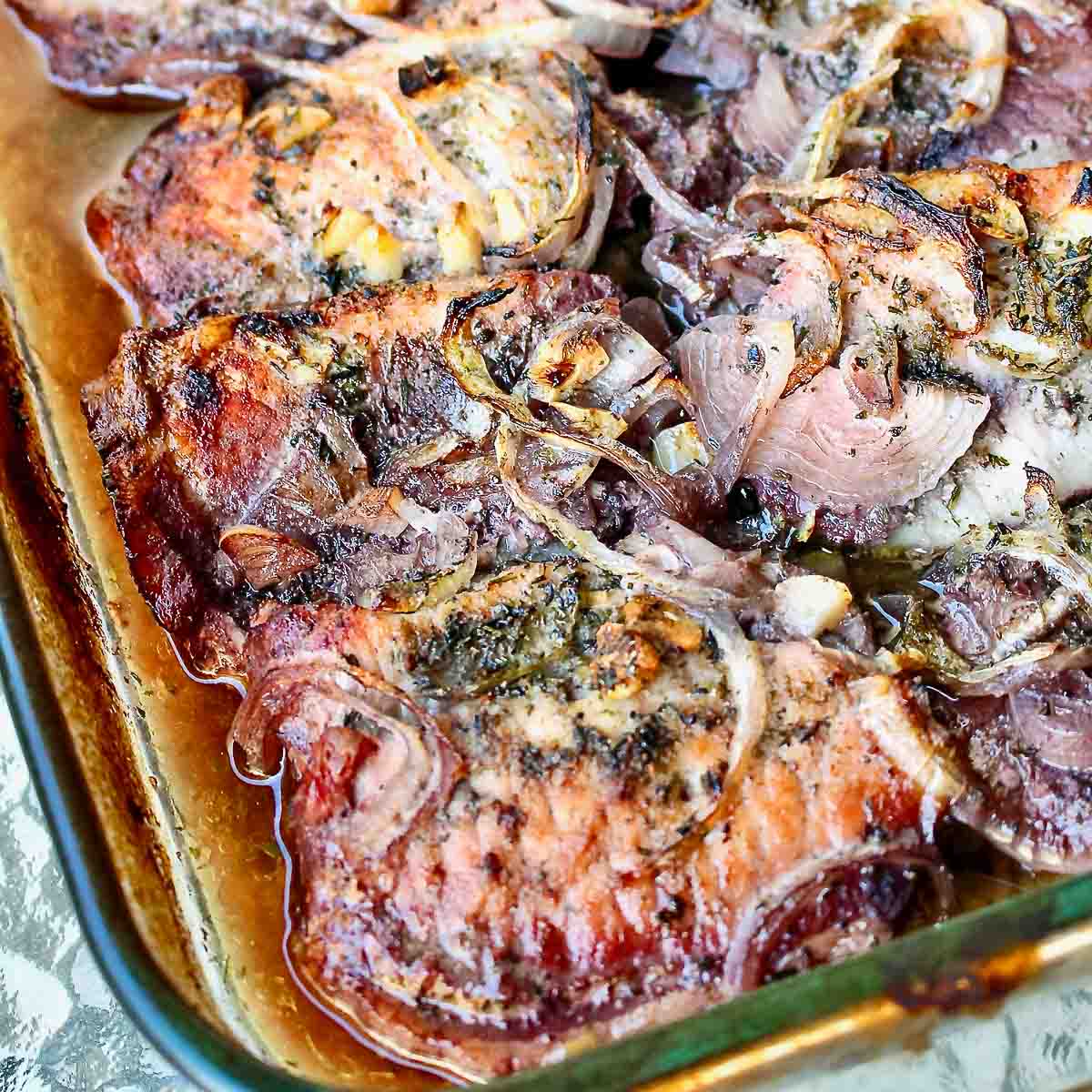 Baked Boneless Pork Chops in a glass baking pan.