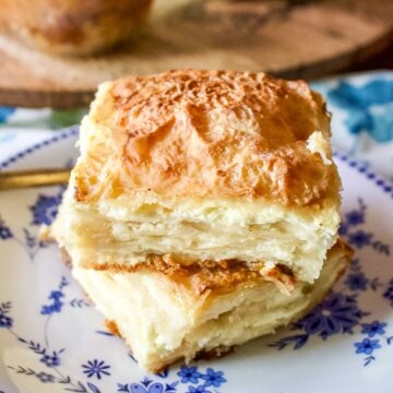 Two slices of sweet cheese slab pie on a plate.