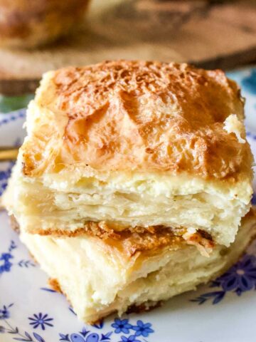 Two slices of sweet cheese slab pie on a plate.