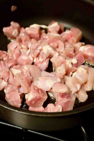 Chicken meat in a cooking pan.