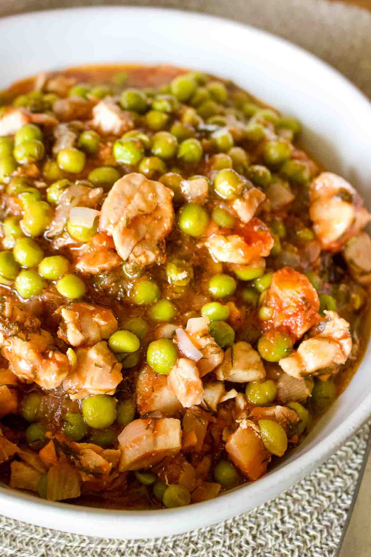 Green Peas With Chicken Stew in a white bowl.