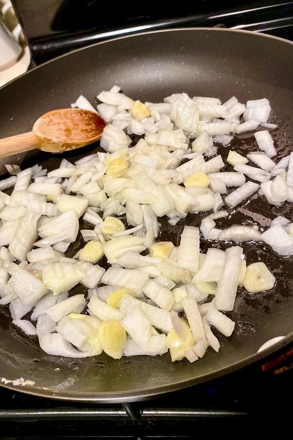 Green Beans Almondine Green Beans with Almonds33 onions and garlic cooking together in a pan