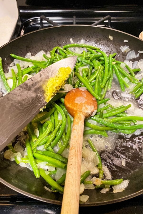 Green Beans Almondine Green Beans with Almonds44 Green Beans cooking in the pan with lemon zest added to the mixture