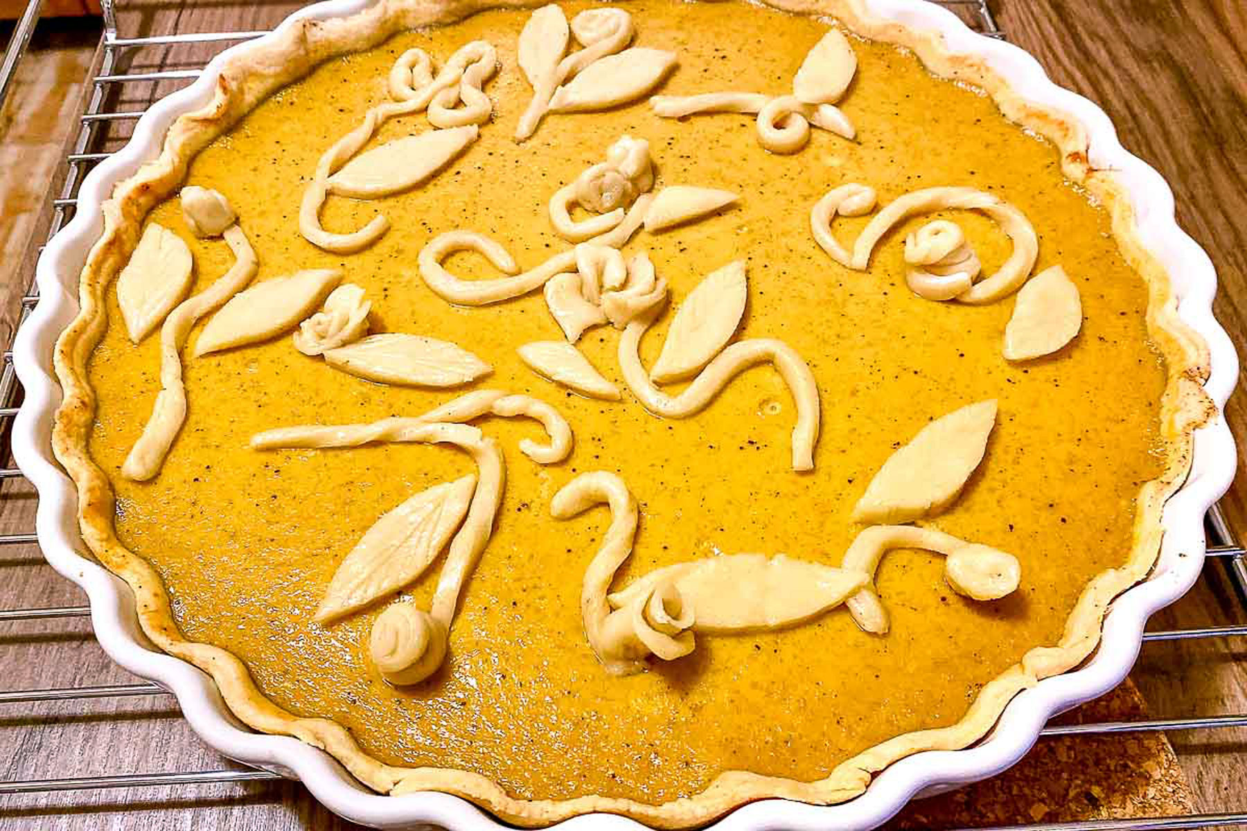 Pumpkin Pie semi baked with decorations.