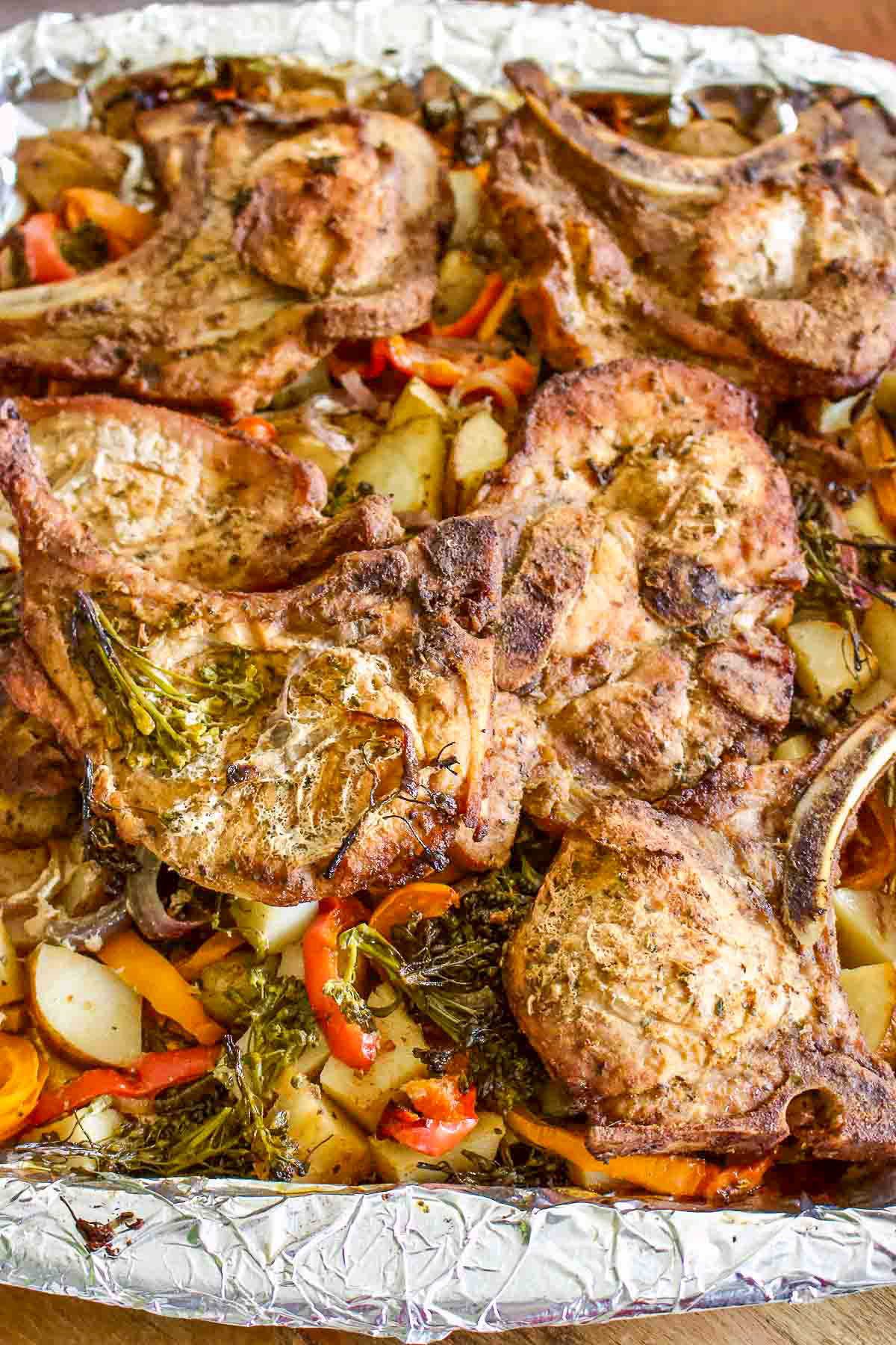 Roasted Pork Chops With Vegetables on a baking tray.