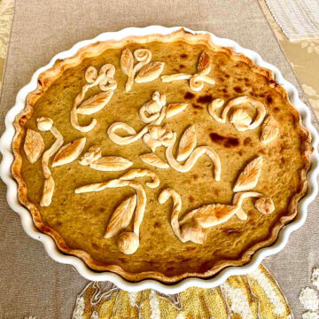 Whisky Flavored Pumpkin Pie in a white baking pie.