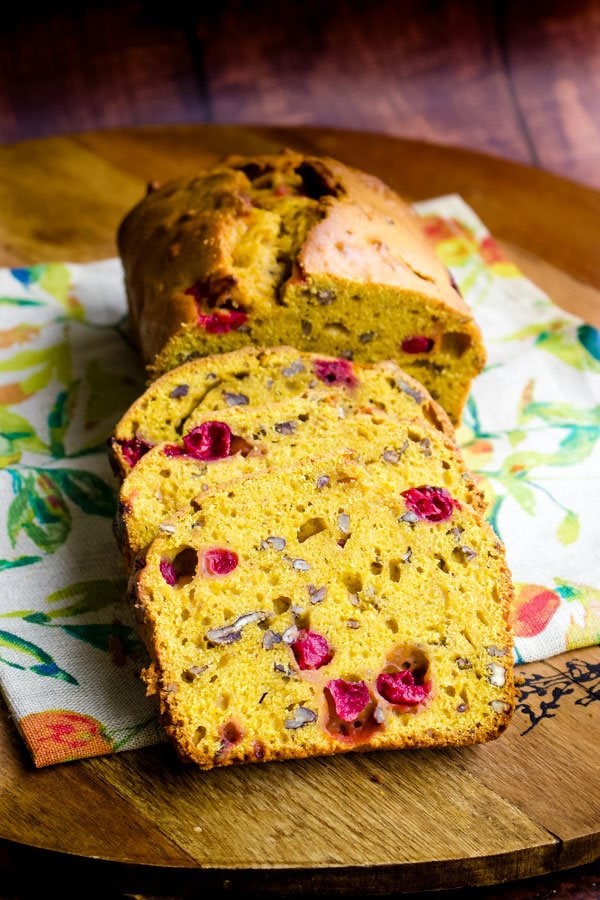Pumpkin bread with fresh cranberries on a kitchen towel