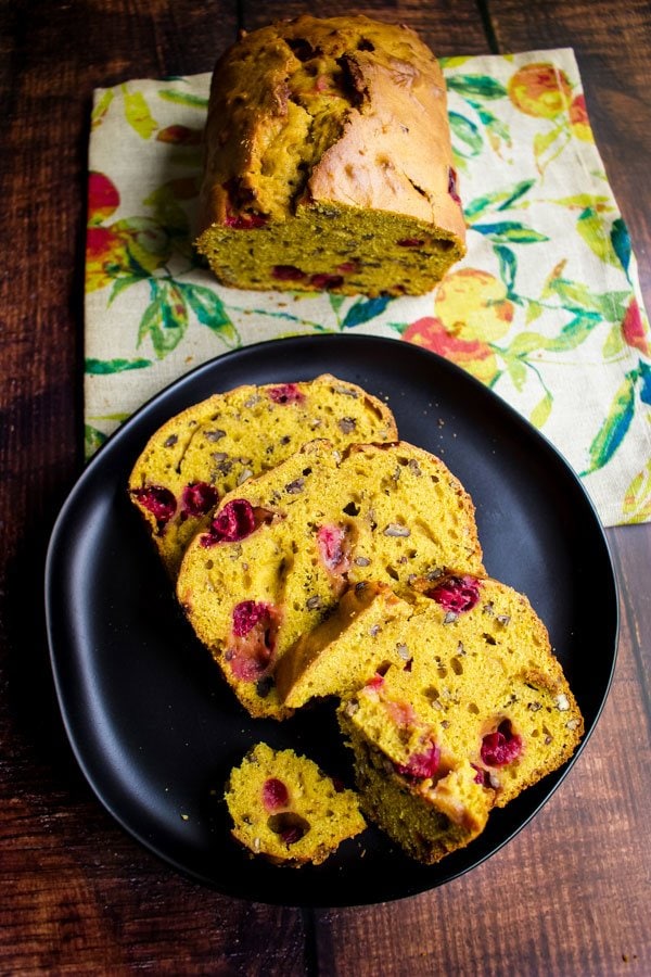 Slices of Pumpkin bread with fresh cranberries on a plate