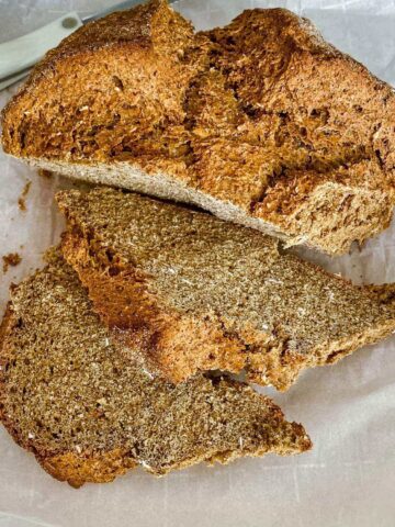 Irish Brown Soda Bread With Molasses on parchment paper.