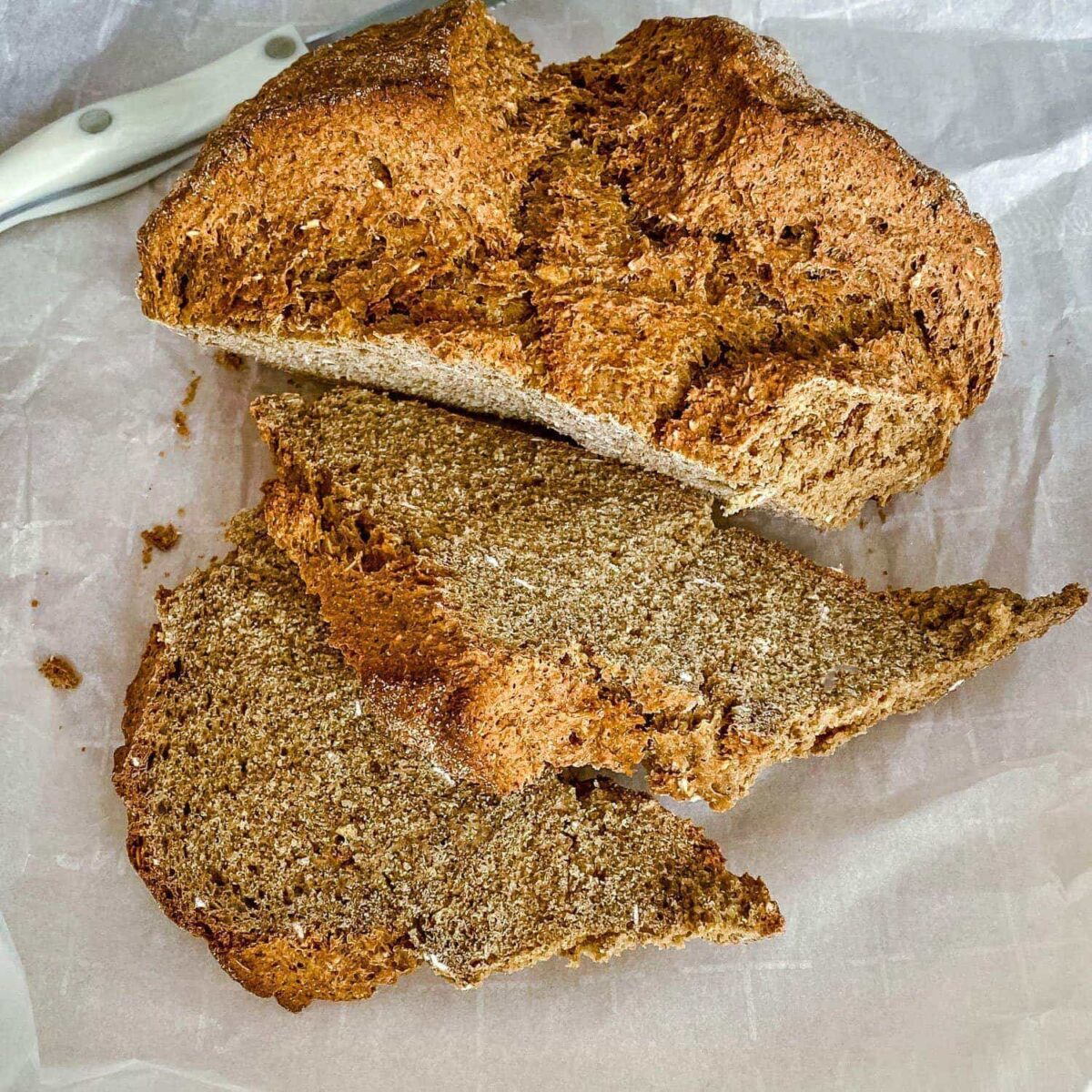 Irish Brown Soda Bread With Molasses on parchment paper.