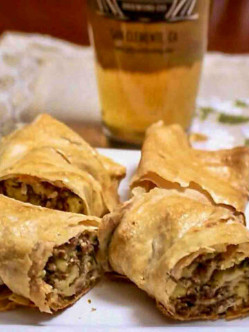 Phyllo Meat And Potato Pie Slices On A White Plate.