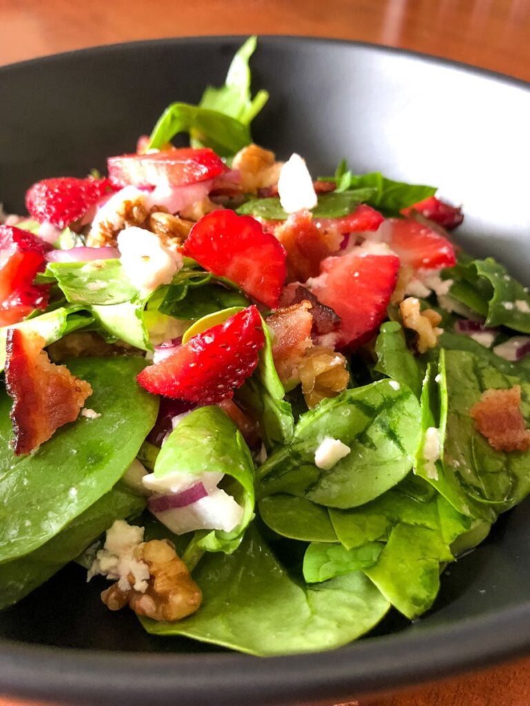 Spinach Strawberry Salad With Walnuts And Feta- close up picture