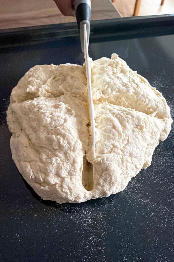 No yeast bread Soda Bread- before baking-with knife cutting a cross on top of the bread