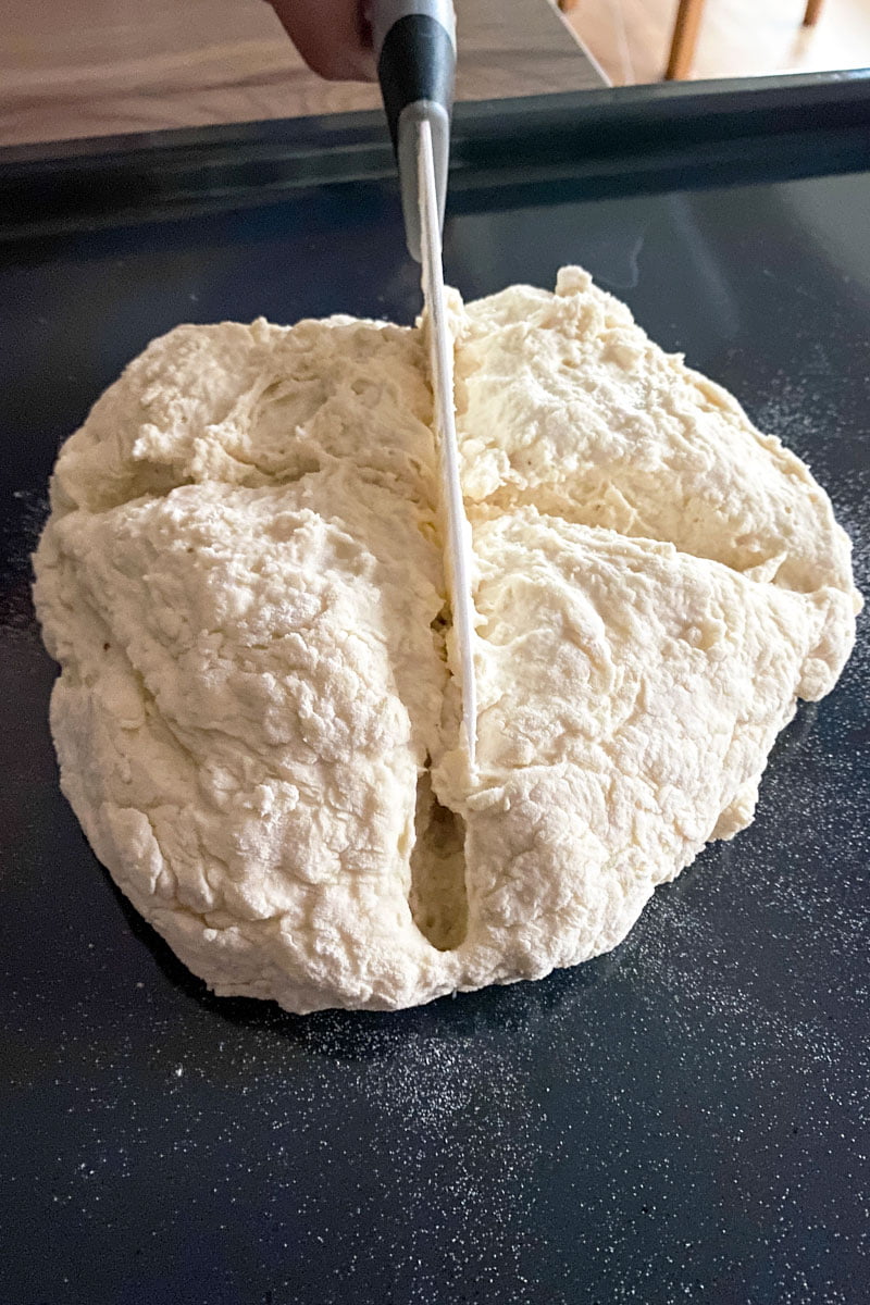 No yeast bread Soda Bread- before baking-with knife cutting a cross on top of the bread