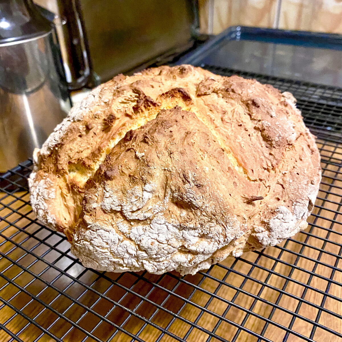Irish bread cooling on a metal rack.