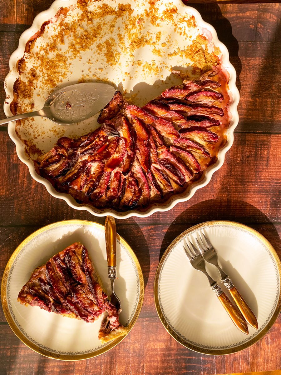 Plum tart slice of tart on plate with fork1
