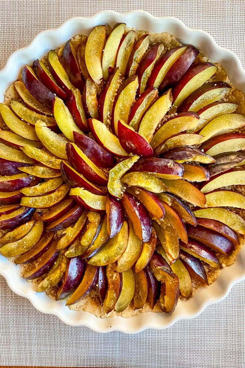 sliced plums on top of the dough without the custard1