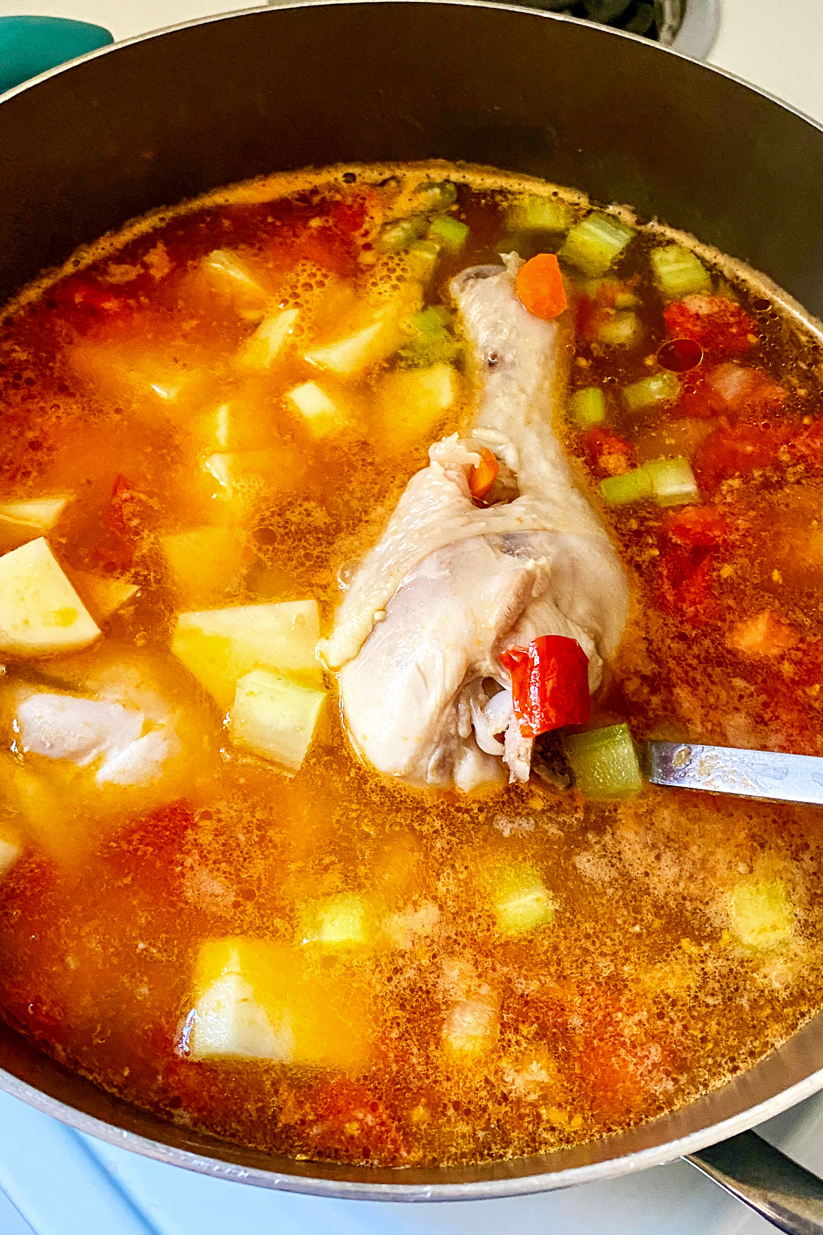 Caldo de pollo in the soup pot when it's finished cooking.