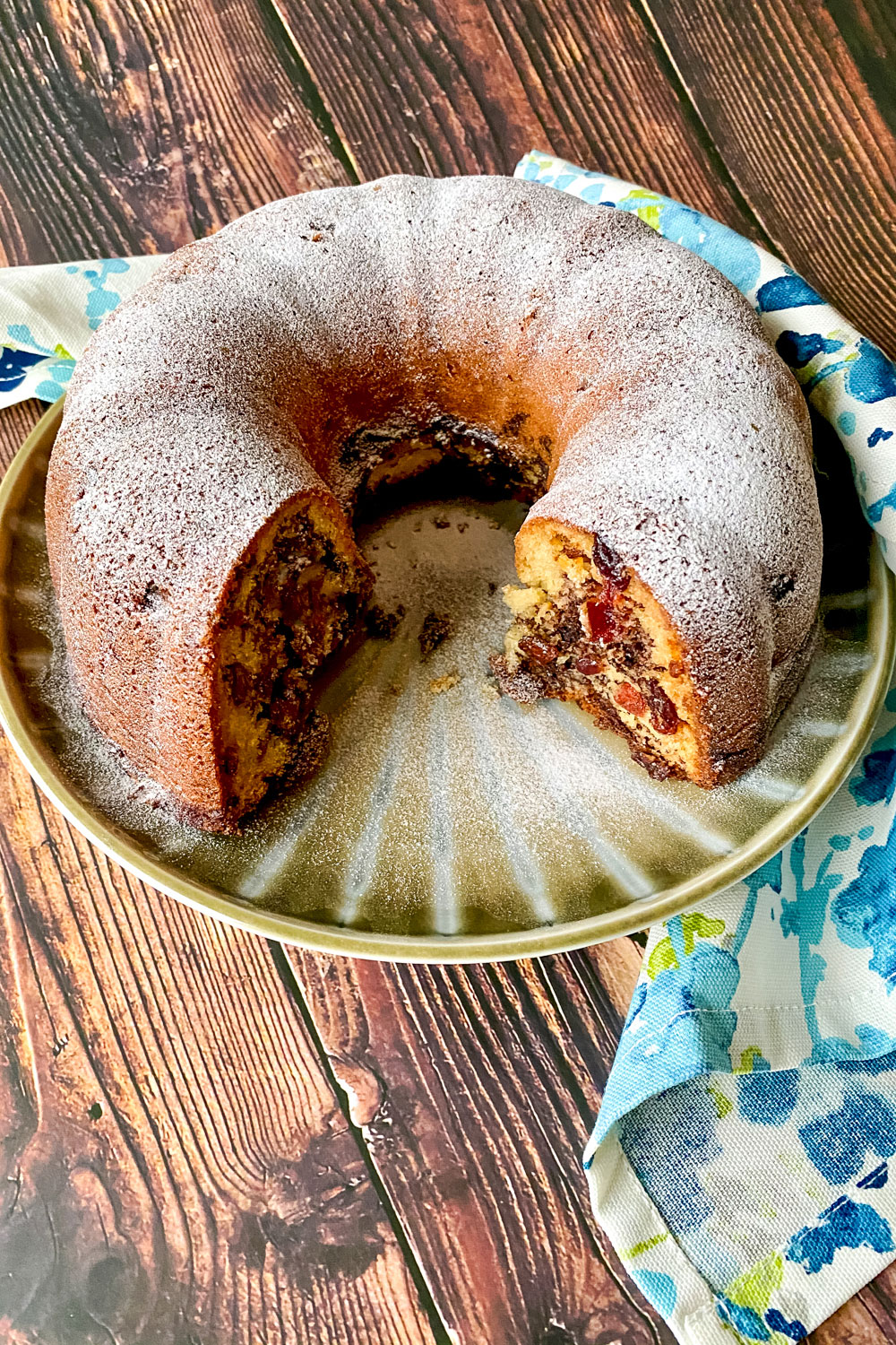 Cinnamon Swirl Coffee Cake on a platter with kitchen towel0